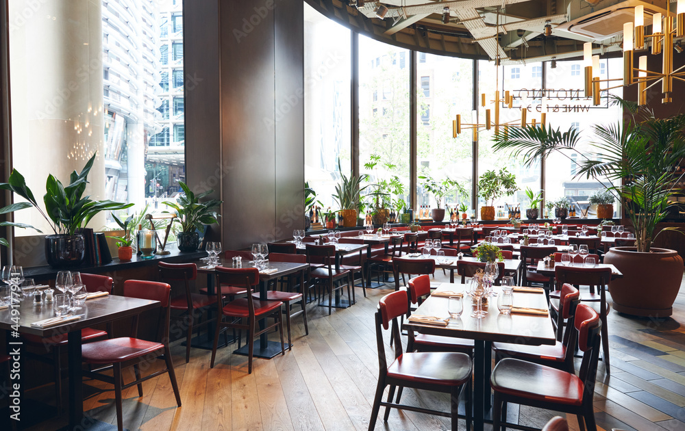 © Southworks - Stylish restaurant interior with set tables © Southworks - Stylish restaurant interior with set tables