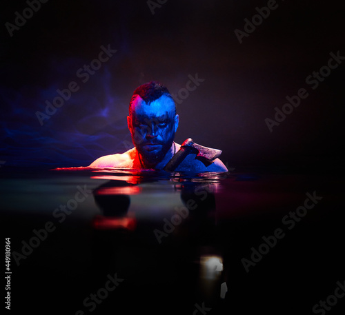 Obraz na płótnie Viking with an axe in the moonlight