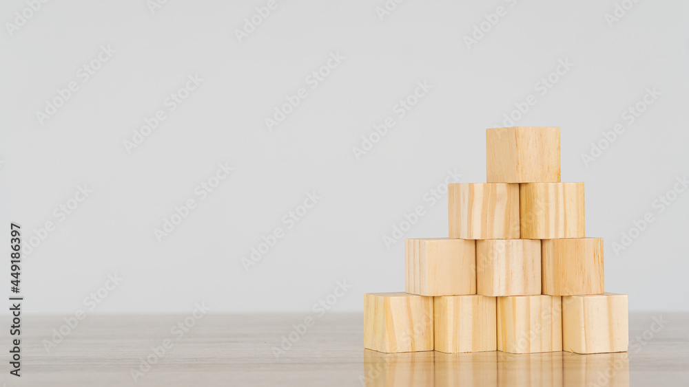 Empty wooden blocks on pyramid-like table, business growth concept on white background. Empty wooden blocks on pyramid-like table, business growth concept on white background.