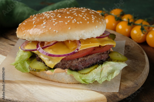 A close up of a sandwich sitting on top of a wooden table