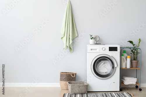 Interior of bathroom with modern washing machine photo