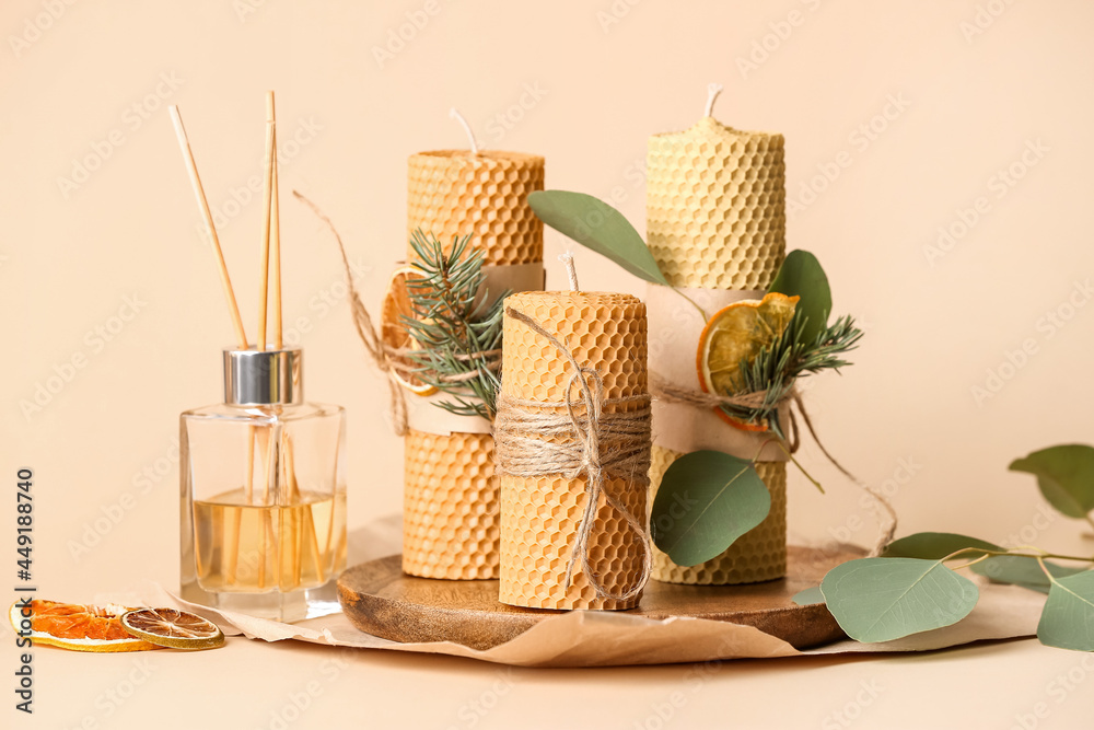 Handmade wax candles and reed diffuser on color background - obrazy, fototapety, plakaty 