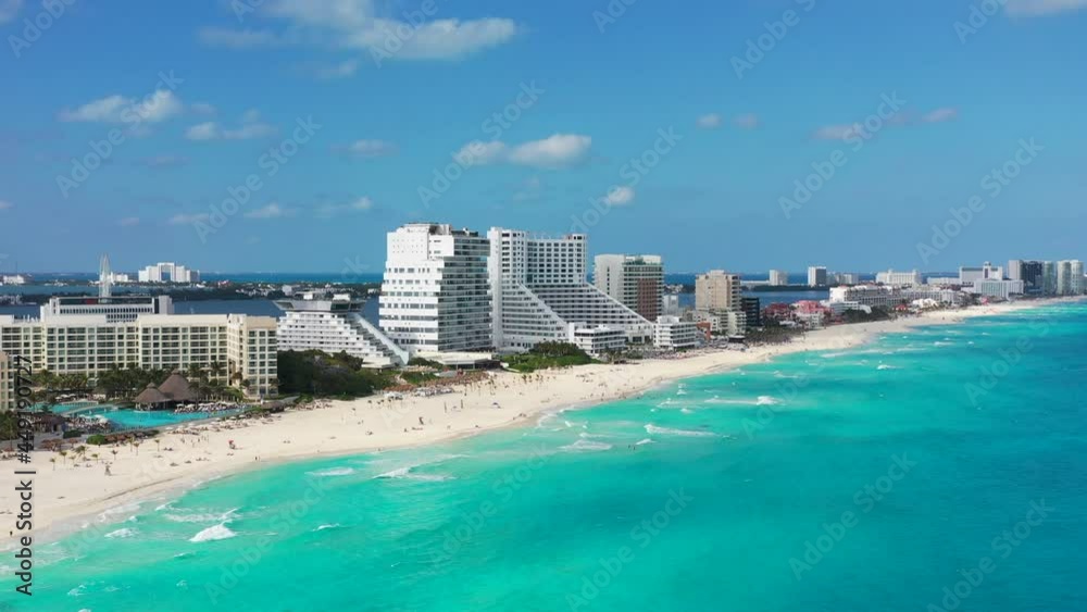 Camera flies over turquoise waters of Cancun towards resorts Camera flies over turquoise waters of Cancun towards resorts