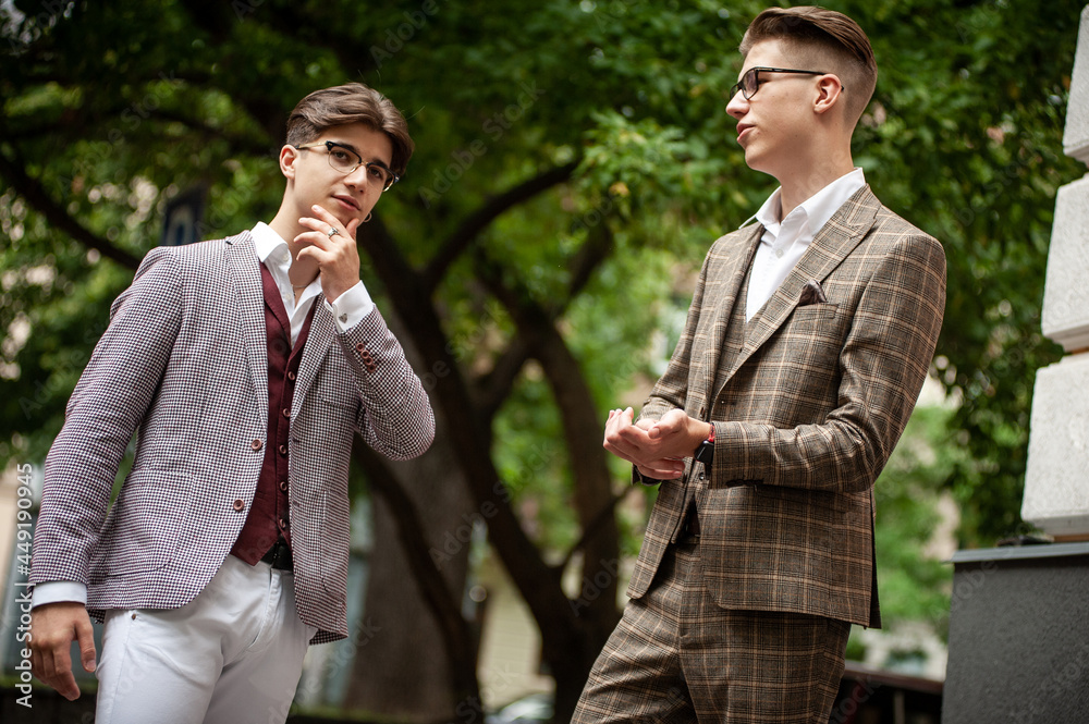 Two young businessmen communicate and solve problems with each other Two young businessmen communicate and solve problems with each other