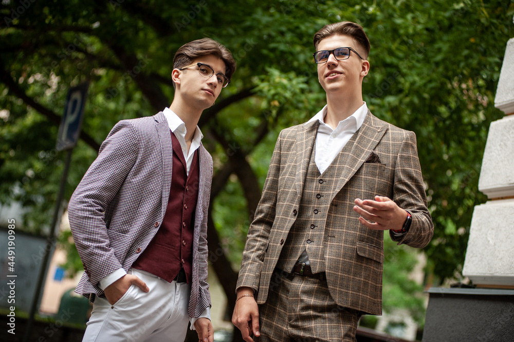 Two young businessmen communicate and solve problems with each other Two young businessmen communicate and solve problems with each other