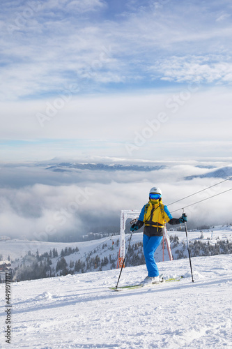 skier woman on the top of the hill
