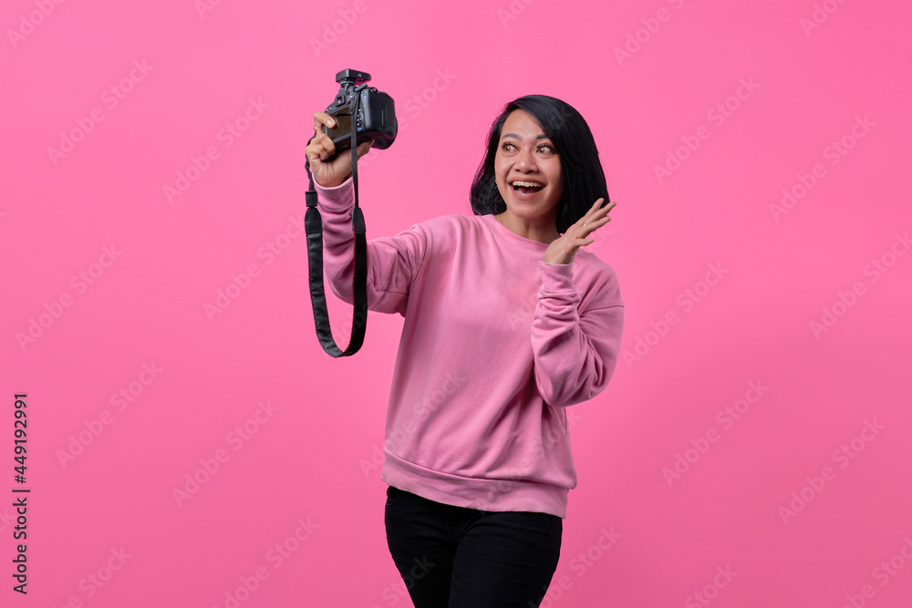 Beautiful girl taking a self portrait with professional camera. Asian girl selfie Beautiful girl taking a self portrait with professional camera. Asian girl selfie