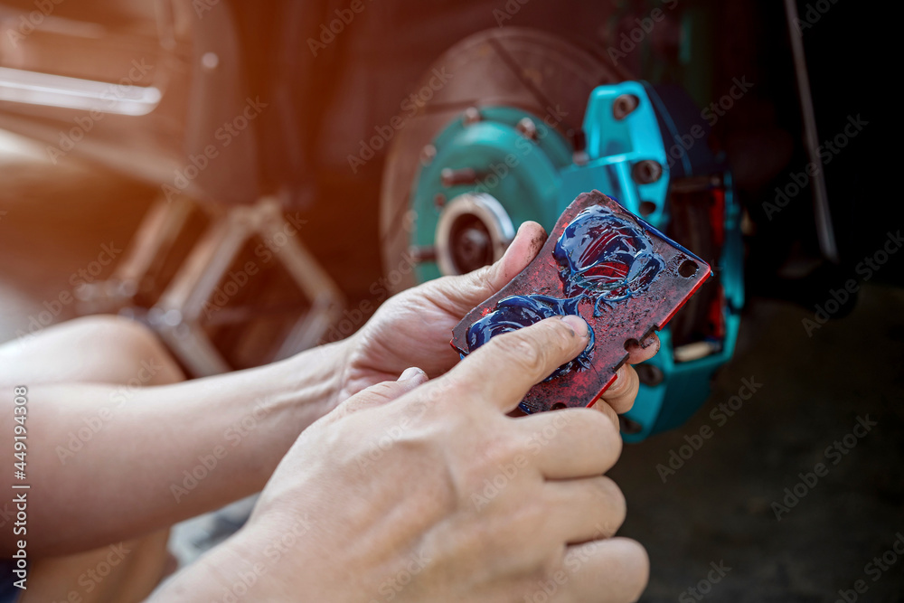 Home service car concept Close up hand a man Hold brake pads and