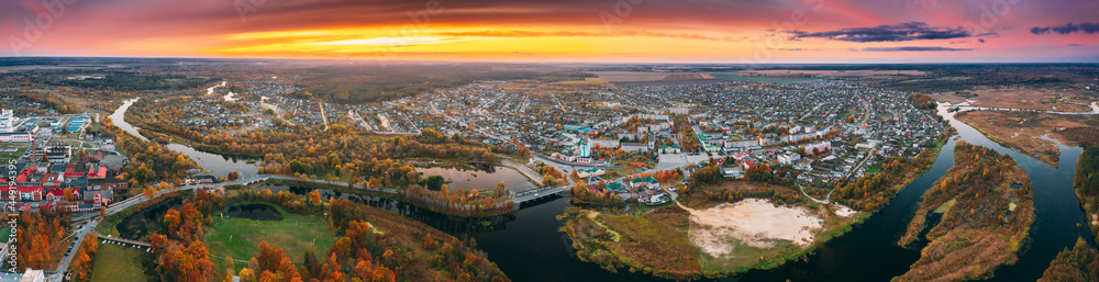 Dobrush, Gomel Region, Belarus. Aerial View Of Dobrush Cityscape Skyline In Autumn Evening. Residential District And River During Sunset. Bird's-eye View. Panorama, panoramic view