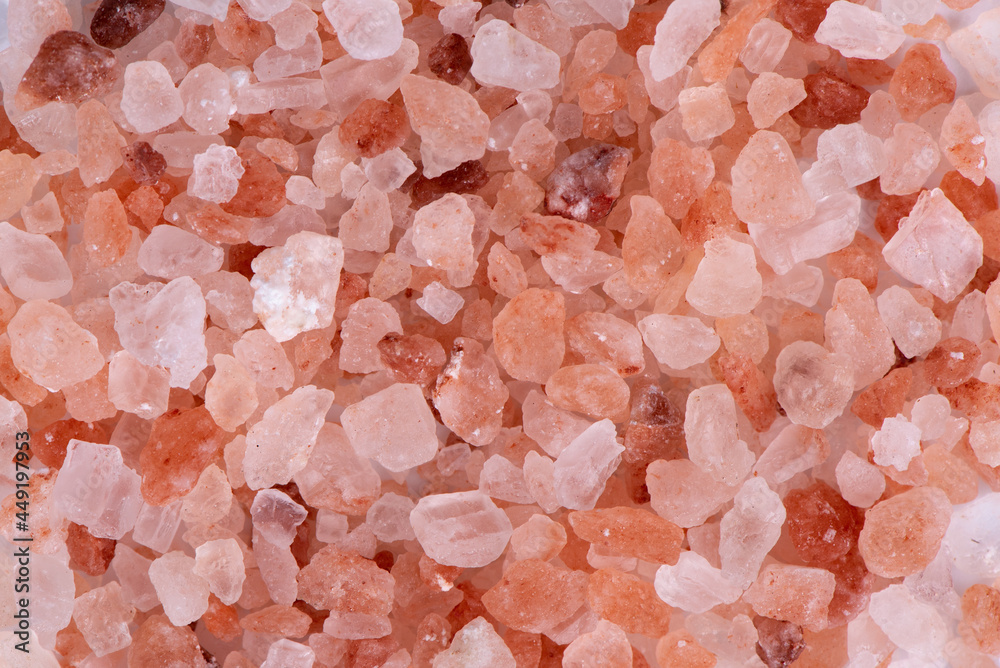 Chopped pink Himalayan salt on black background Chopped pink Himalayan salt on black background