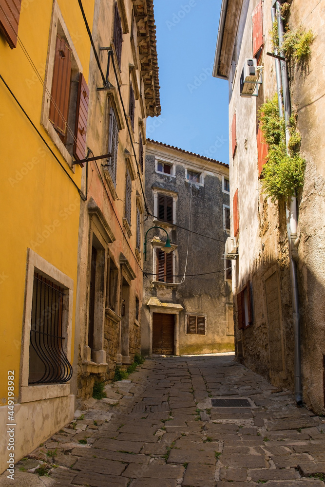 A residential road in the historic medieval hill village of Buje in Istria, Croatia

