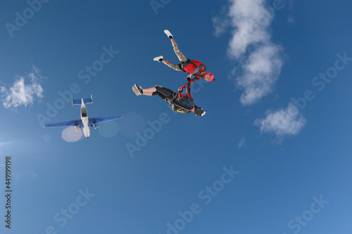 Skydiving. Freefly jump. Two guys just jumped out of a plane.