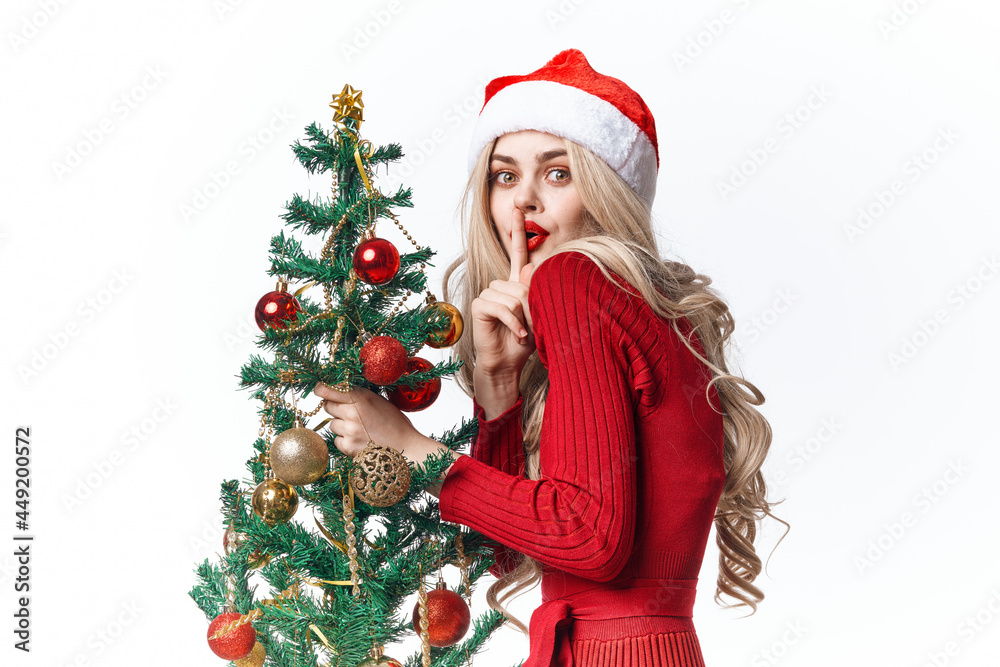 Cheerful Woman holiday toys Christmas tree decoration fun Cheerful Woman holiday toys Christmas tree decoration fun