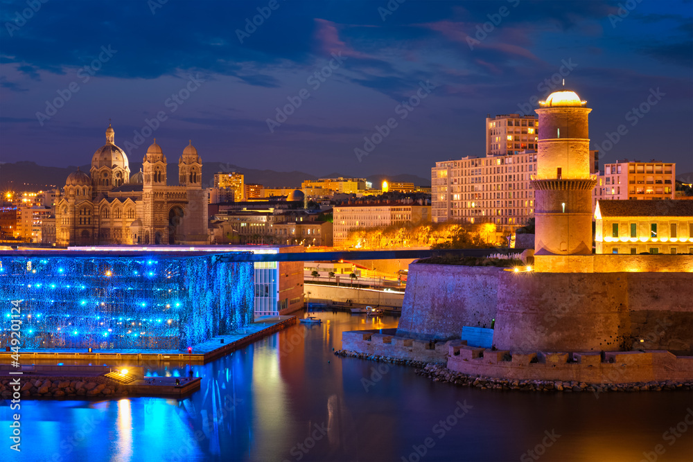 Marseille Old Port and Fort Saint-Jean in night. France
