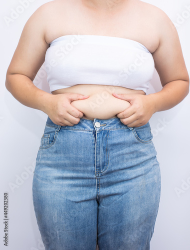 beautiful fat woman with tape measure on white background she wants to lose weight The concept of underarm liposuction surgery lose belly fat and break down thigh fat.