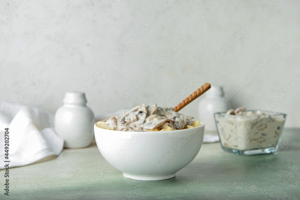 Bowl with tasty mashed potatoes and mushrooms on table Bowl with tasty mashed potatoes and mushrooms on table
