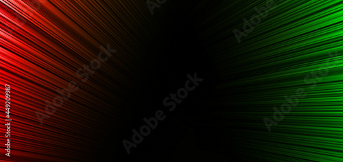 Abstract red and green elegant stripe diagonal lines light on black background.
