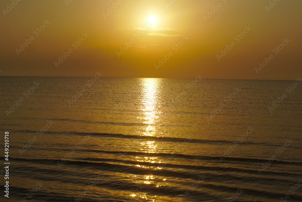 sunset over the calm sea sunset over the calm sea