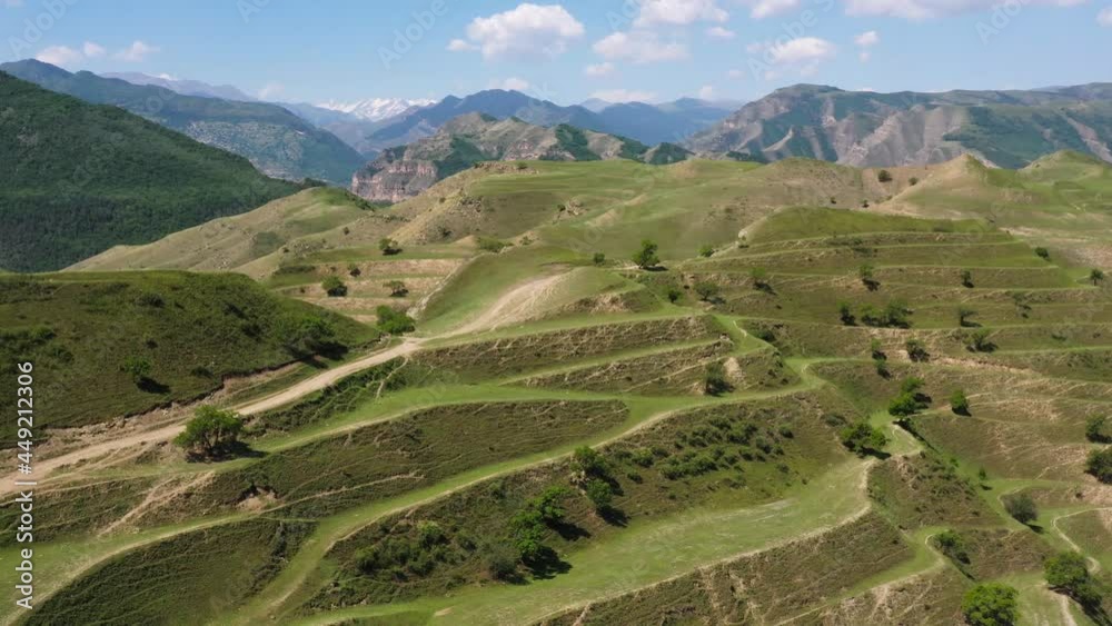 Top view on the green agricultural fields in countryside ,mountains valley at sunlight, beautiful rural scene with green fields Top view on the green agricultural fields in countryside ,mountains valley at sunlight, beautiful rural scene with green fields