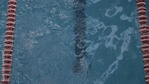 Young latin girl practicing leg stroke and passing by