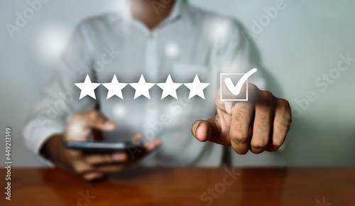 Customer Experience Concept, Best Excellent Services Rating for Satisfaction present by hand of Client pressing Five Star