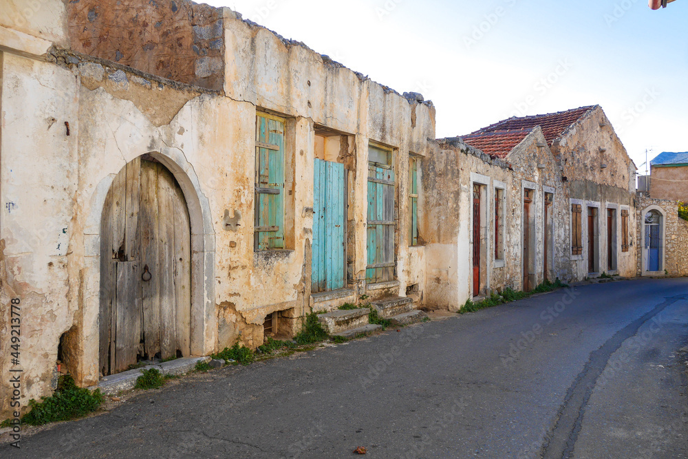 Street with old houses in Kastelli Fournis, Crete, Greece