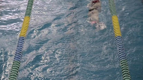 Young latin girl practicing freestyle or crawl