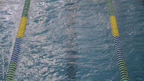 Young latin boy with overweight swimming