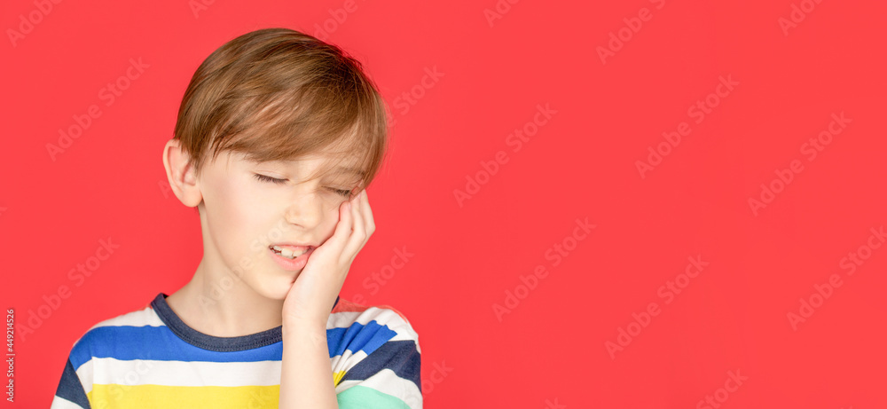 Toothache painkiller. Dental disease. Toothache as dental pain. Dentist concept. Portrait boy has a toothache. Oral care concepts Toothache painkiller. Dental disease. Toothache as dental pain. Dentist concept. Portrait boy has a toothache. Oral care concepts