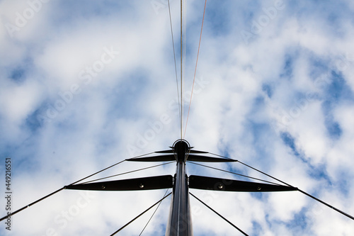 Mast of a sailing yacht without a sail. View from below.