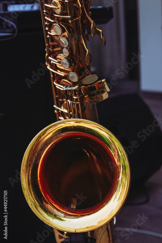 Golden saxophone on stand close-up