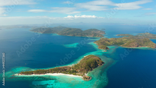aerial view tropical islands with blue lagoons, coral reef and sandy beach. Palawan, Philippines. Islands of the Malayan archipelago with turquoise lagoons. © Alex Traveler
