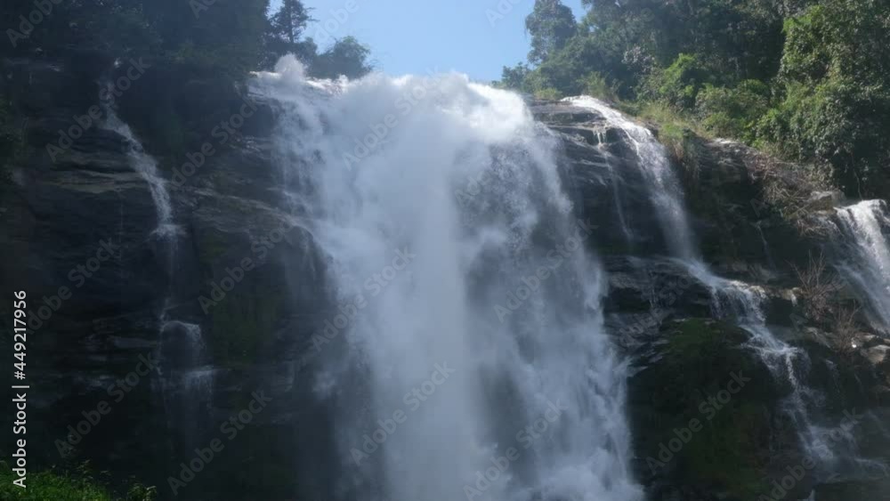Waterfall with a large amount of water during the rainy season of the tropical forest. Waterfall with a large amount of water during the rainy season of the tropical forest.