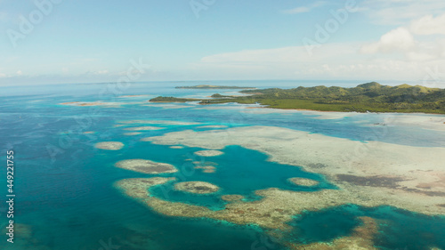 Fototapeta Naklejka Na Ścianę i Meble -  Islands are surrounded by an atoll and a coral reef with blue water top view. Bucas grande, Philippines. Summer and travel vacation concept.