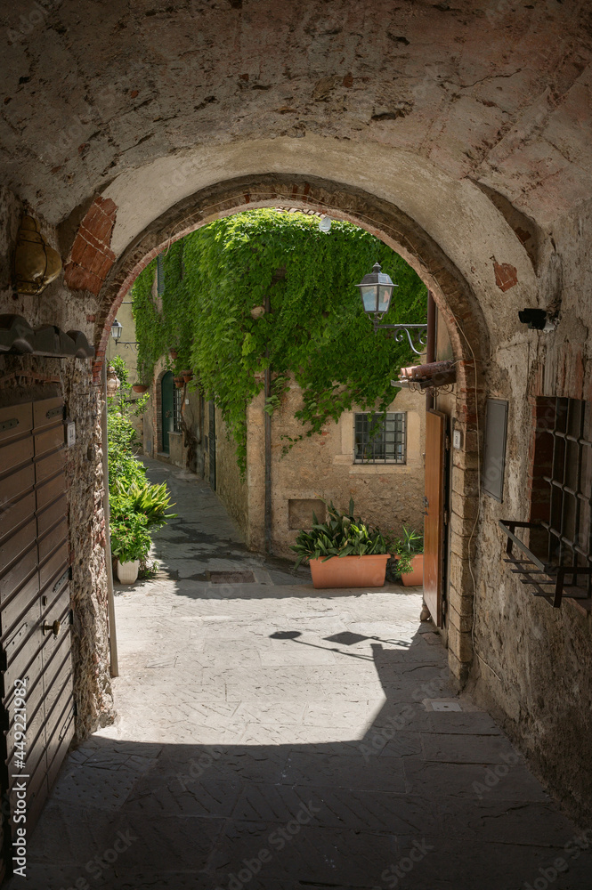 narrow alley in picturesque tuscan village of Capalbio