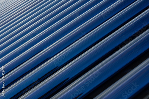 Solar panel tubes in a line as abstract patterns and background 