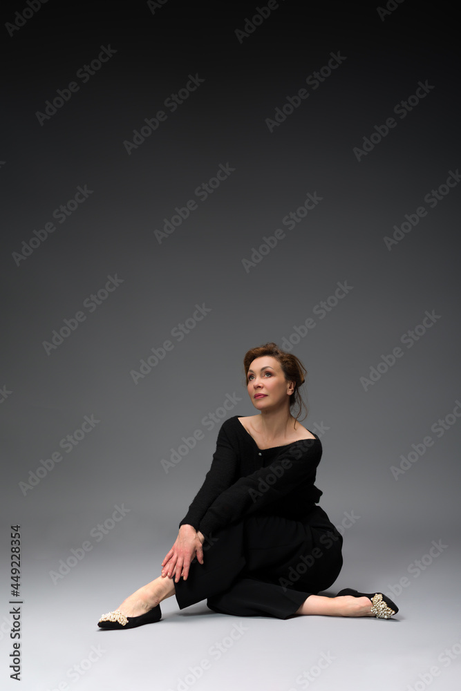 full length portrait of a fashionable aged woman isolated on grey full length portrait of a fashionable aged woman isolated on grey
