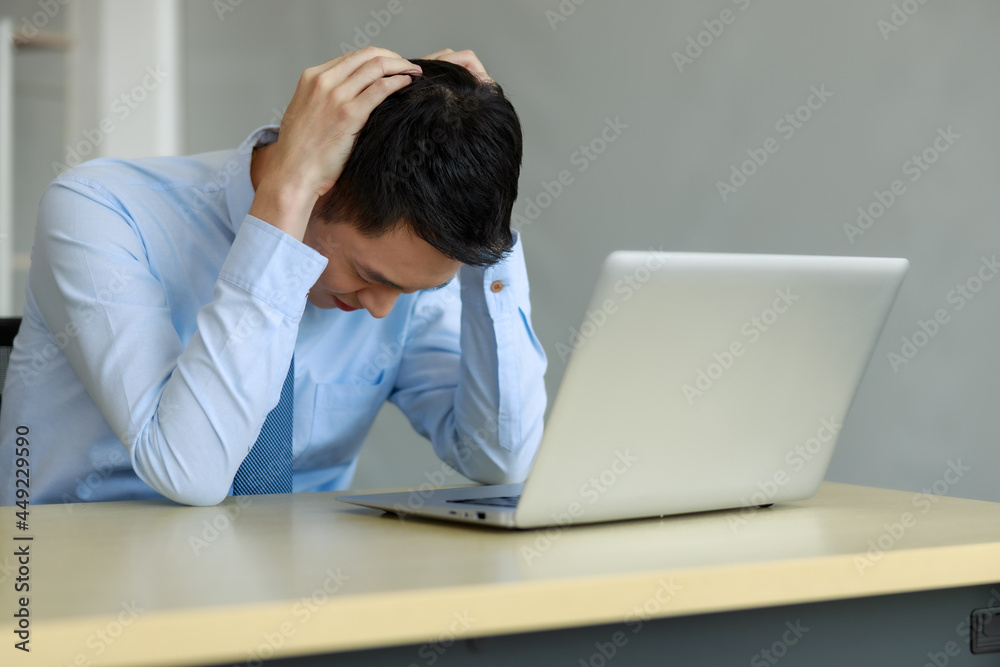 asian businessmann stressed for working project deadline in office asian businessmann stressed for working project deadline in office
