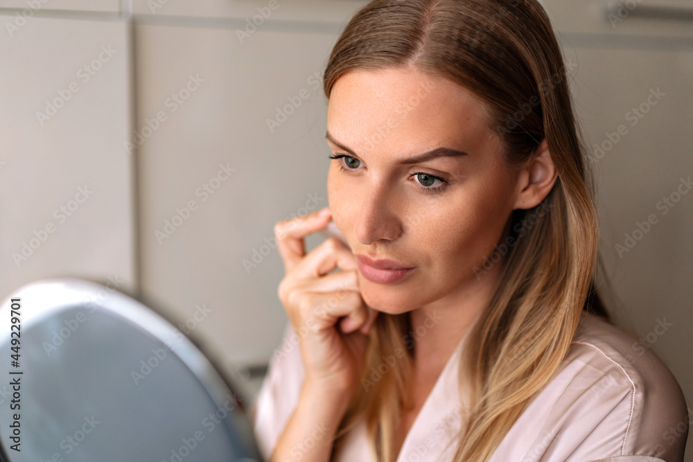 Portrait of beautiful female pretty 30s woman posing indoor have healthy well-kept skin. Style and beauty, skin care concept, daily routine for face. Holding guasha massager. Portrait of beautiful female pretty 30s woman posing indoor have healthy well-kept skin. Style and beauty, skin care concept, daily routine for face. Holding guasha massager.
