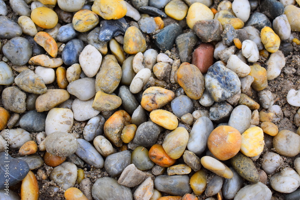 Shiny, colourful peebles on the beach. Shiny, colourful peebles on the beach.