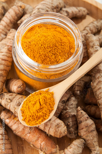 Fresh organic root and turmeric powder - Curcuma longa; Healthy Food.