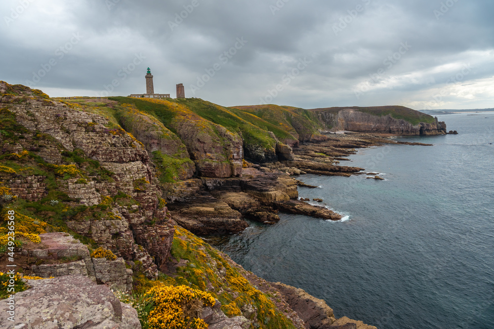 The beautiful coastline next to the Phare Du Cap Frehel is a maritime lighthouse in Cotes-d´Armor (France). At the tip of Cap Frehel