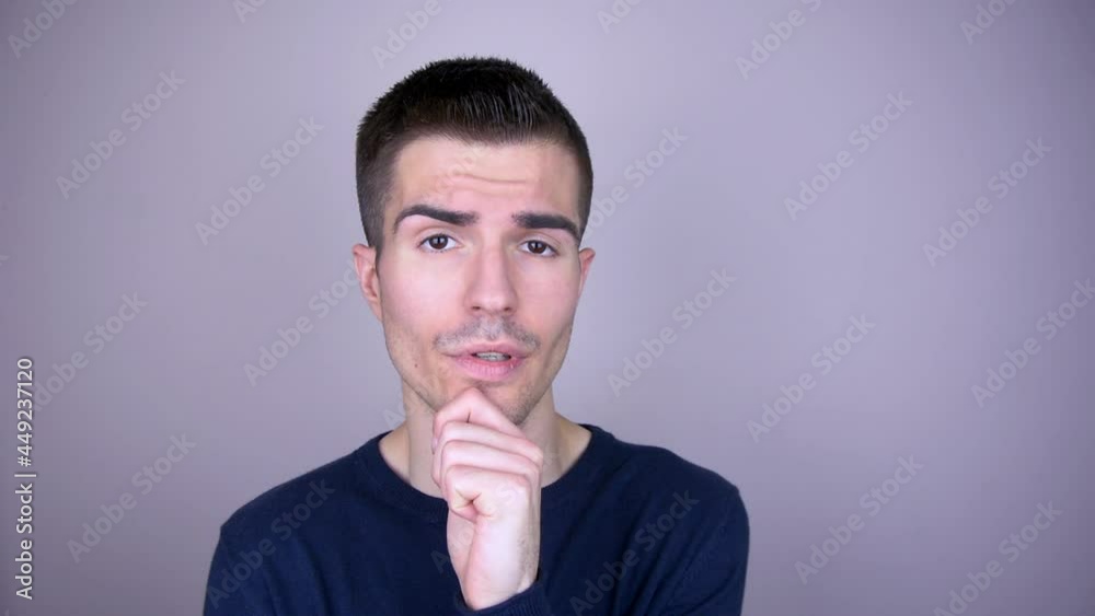 The pensive man props his chin up and sighs several times The pensive man props his chin up and sighs several times