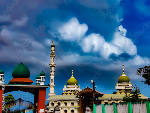 Malikdinar Mosque Thalangara.The Ancient architectural mosque is one of the famous tourist location in Kerala. Cloudy blue sky above the structure makes beautiful
