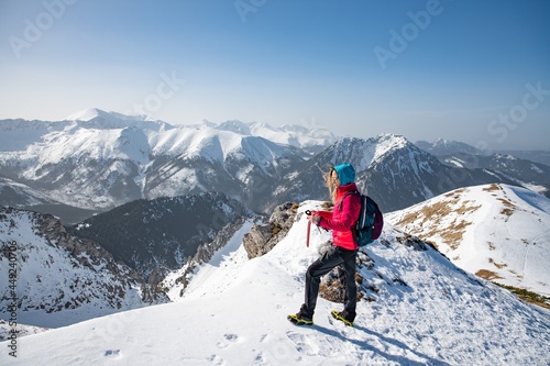 Trekking and hiking inspiration and motivation in beautiful landscape. Travel healthy lifestyle outdoors on snow.