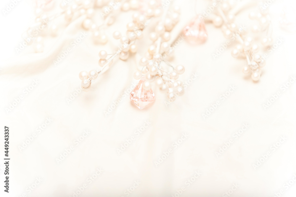 white pearls and pink jewels nestled in white silk