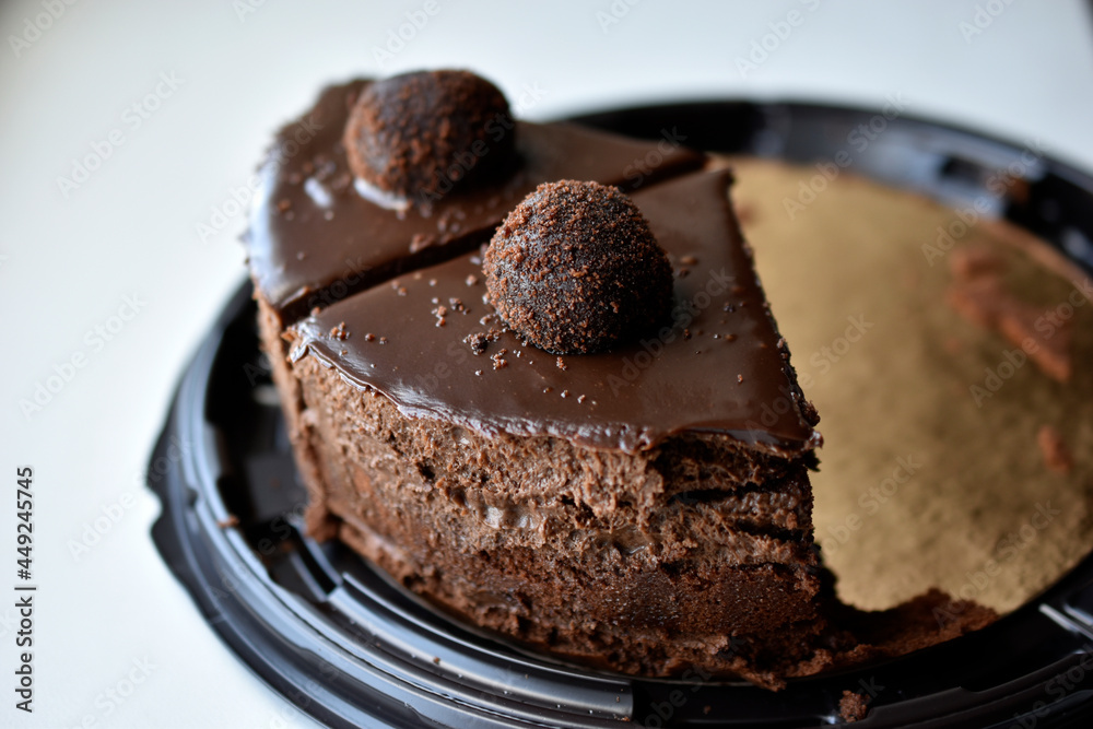 Yummy chocolate cake on a plate close-up Yummy chocolate cake on a plate close-up