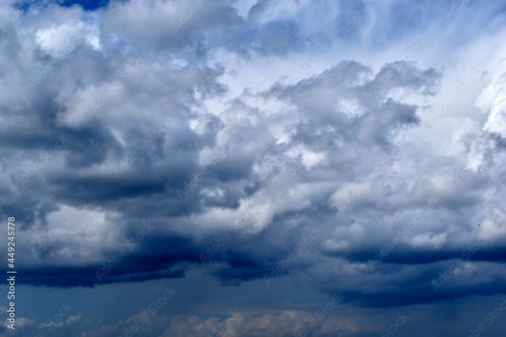 Blue and white cumulus clouds before a thunderstorm Blue and white cumulus clouds before a thunderstorm