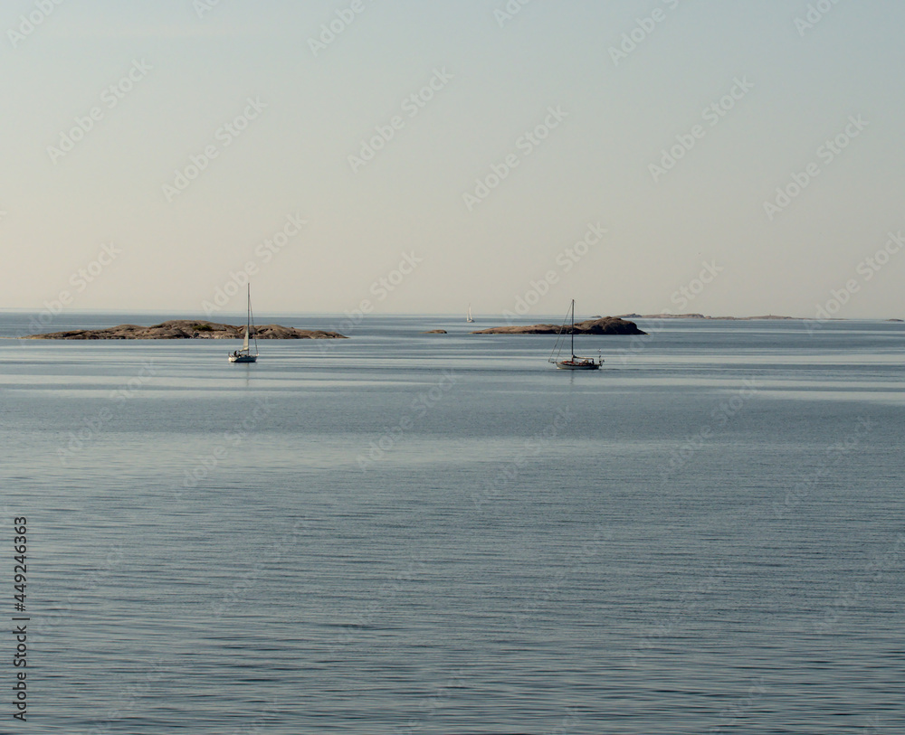 Sailing boats near rocky islands in Baltic sea, near Hanko, Finland Sailing boats near rocky islands in Baltic sea, near Hanko, Finland