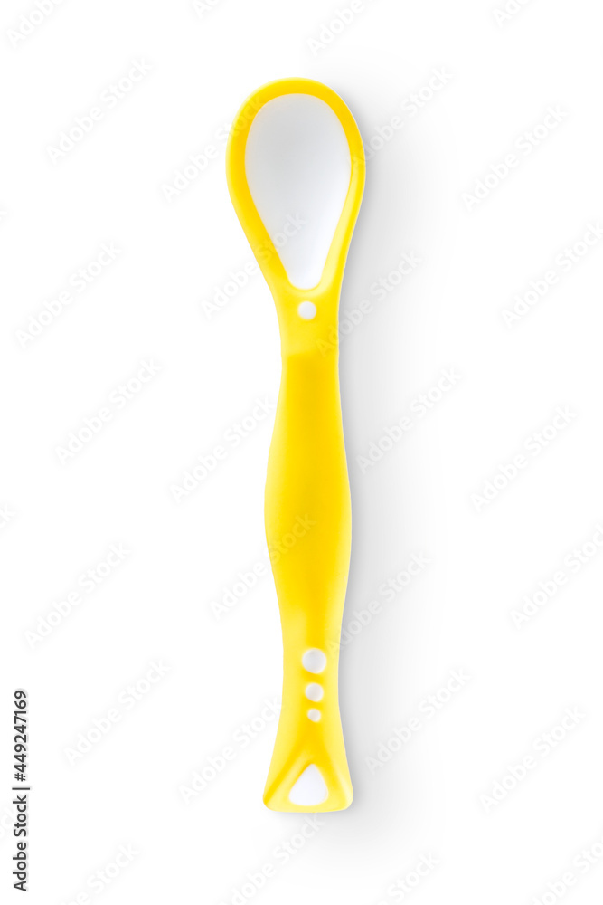 Top view of fun yellow child spoon isolated Top view of fun yellow child spoon isolated